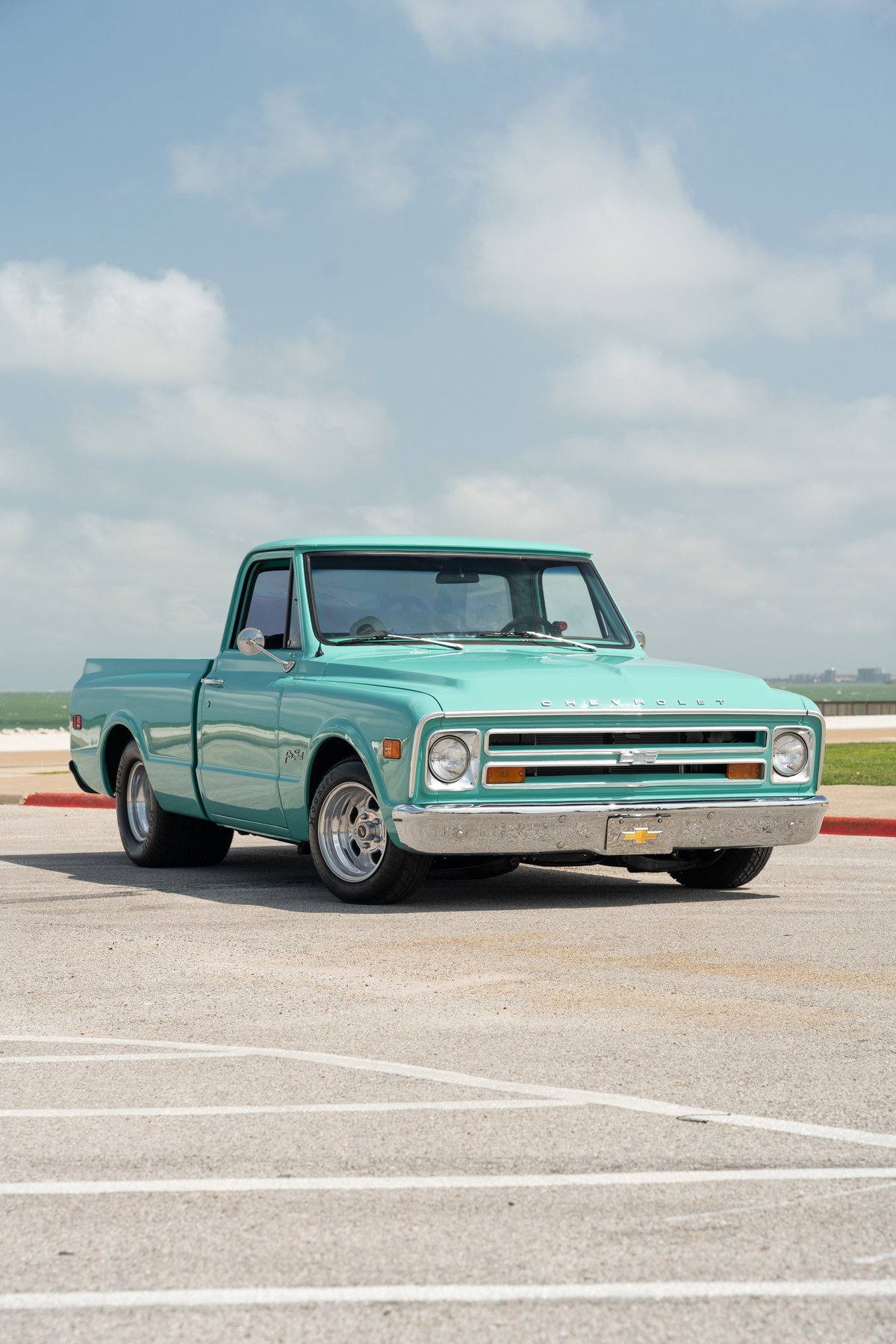 1968 Chevrolet C10 Pro-Street pickup in teal, with chrome trim and polished alloy rims.