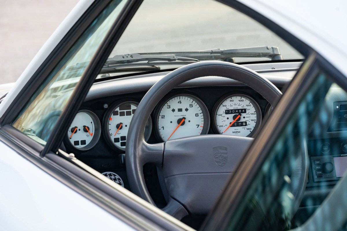 1997 Porsche 993 C4S interior. White gauges, leather steering wheel.