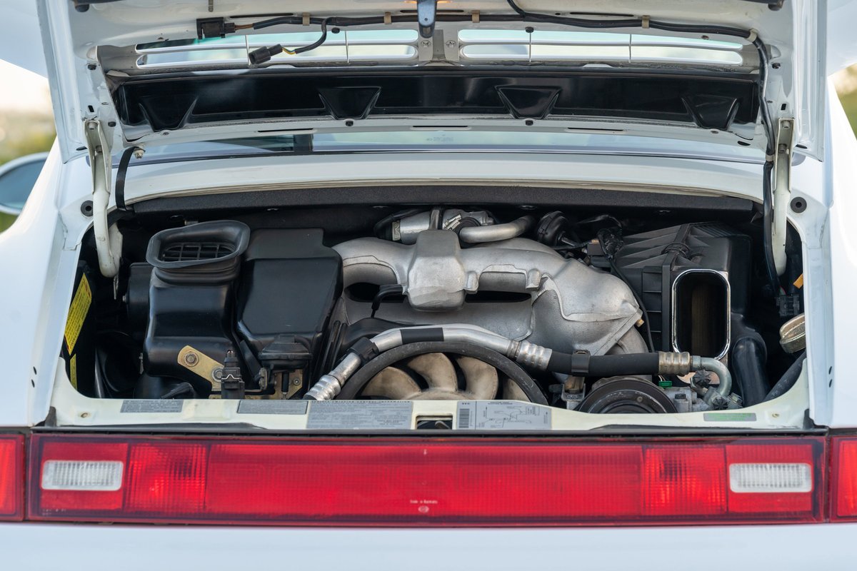 1997 Porsche 993 C4S Glacier White engine bay, twin-turbo boxer engine.
