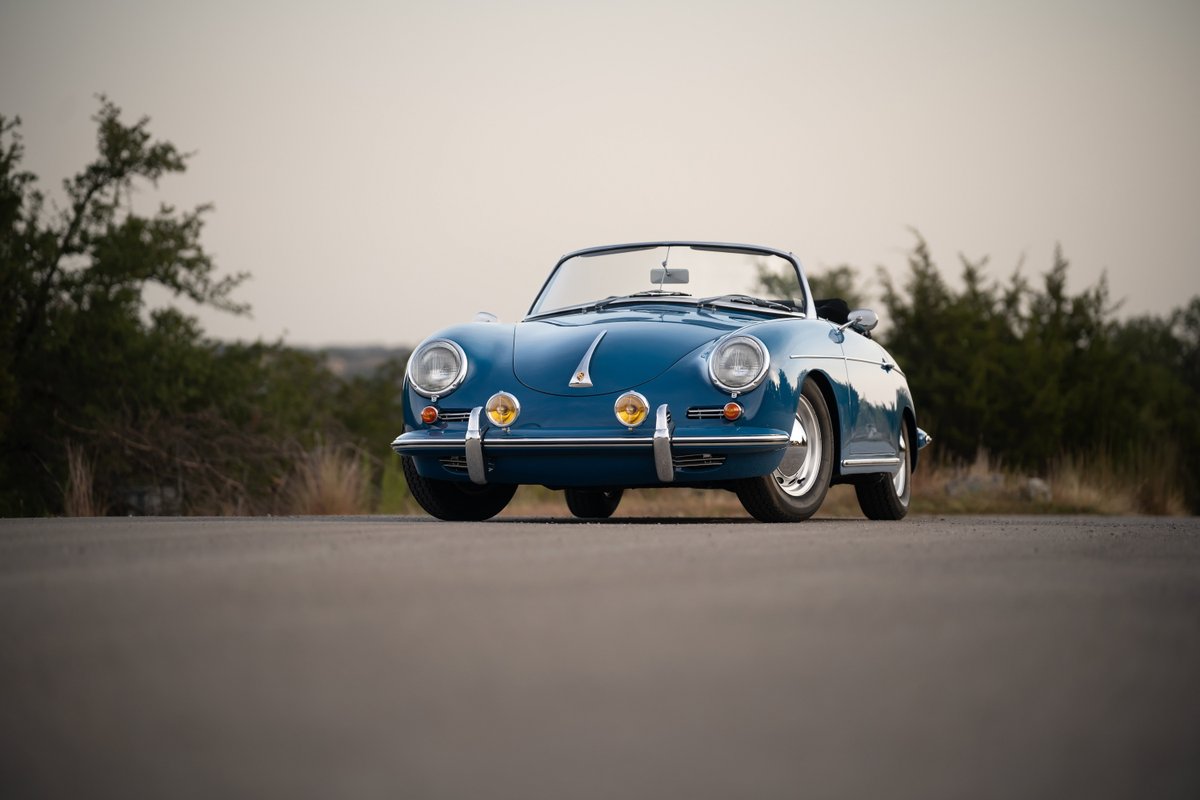Blue 1960 Porsche 356B Roadster with chrome trim and alloy rims.