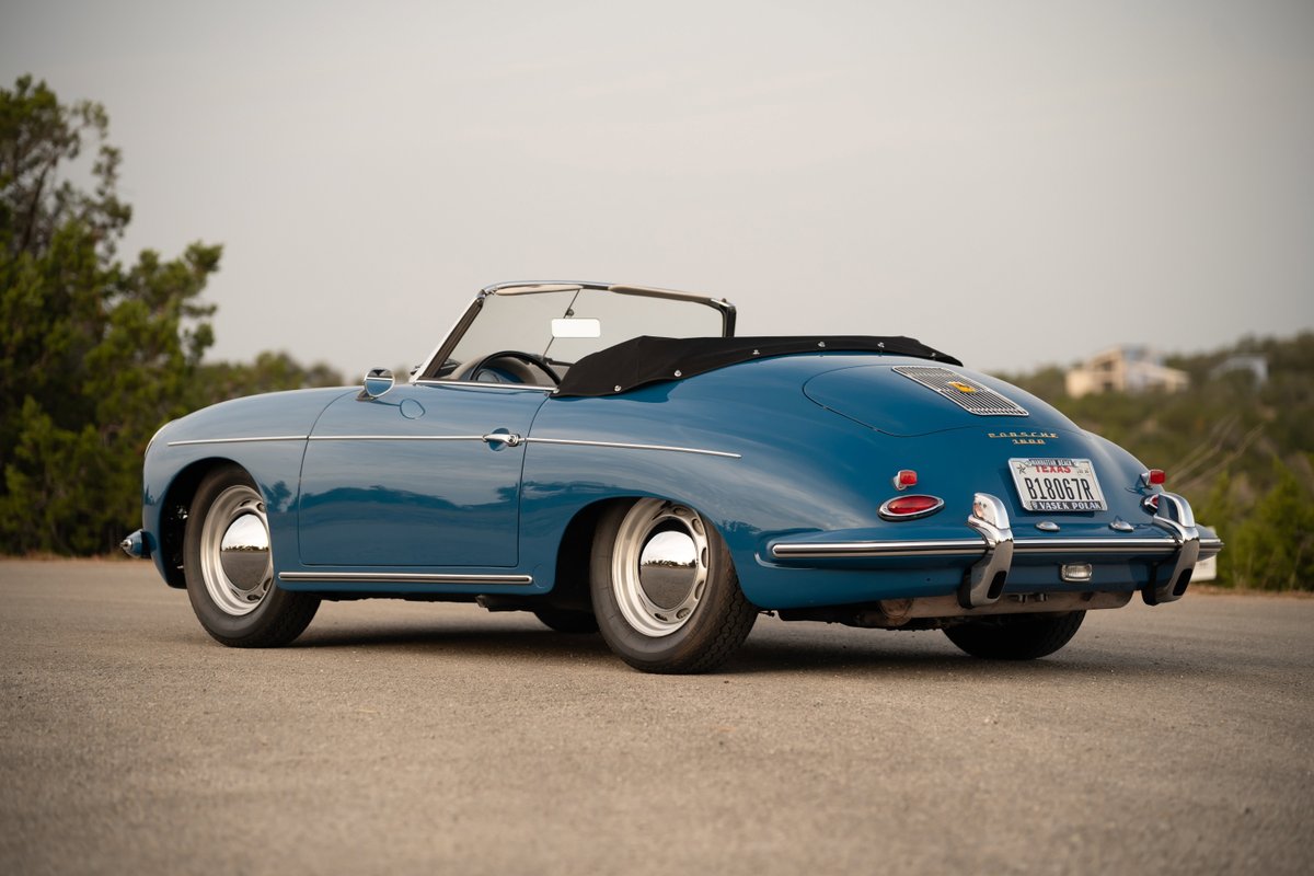 Blue 1960 Porsche 356B Roadster with chrome rims and trim.
