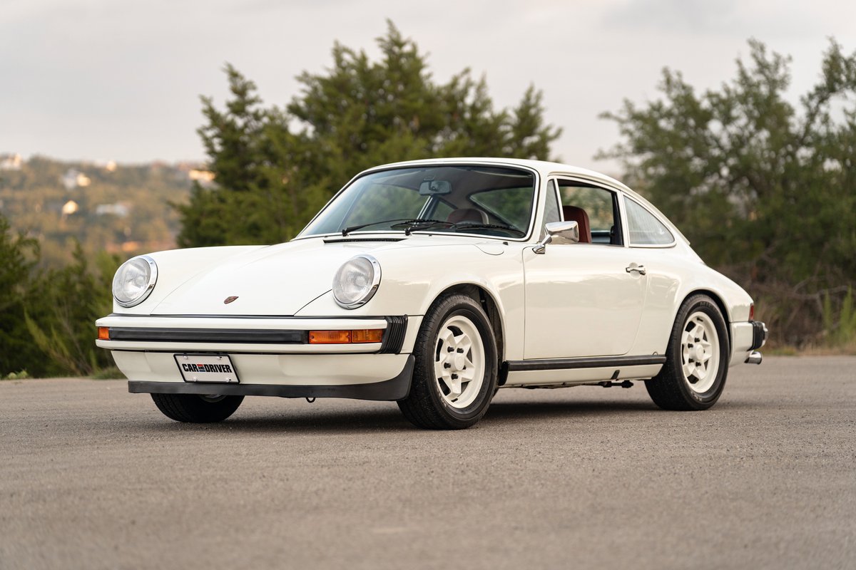 White 1974 Porsche 911 coupe with Fuchs-style rims.