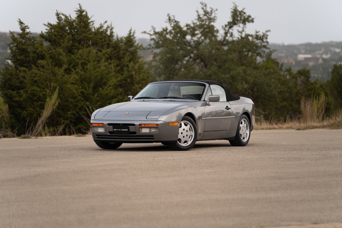 1990 Porsche 944 S2 Cabriolet in Titanium Metallic, featuring Fuchs-style rims.