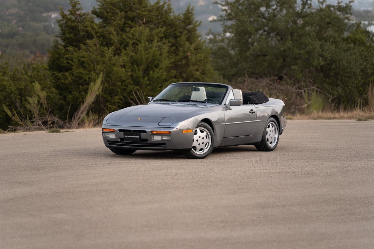 1990 Porsche 944 S2 Cabriolet in Titanium Metallic. Features chrome trim and phone dial rims.