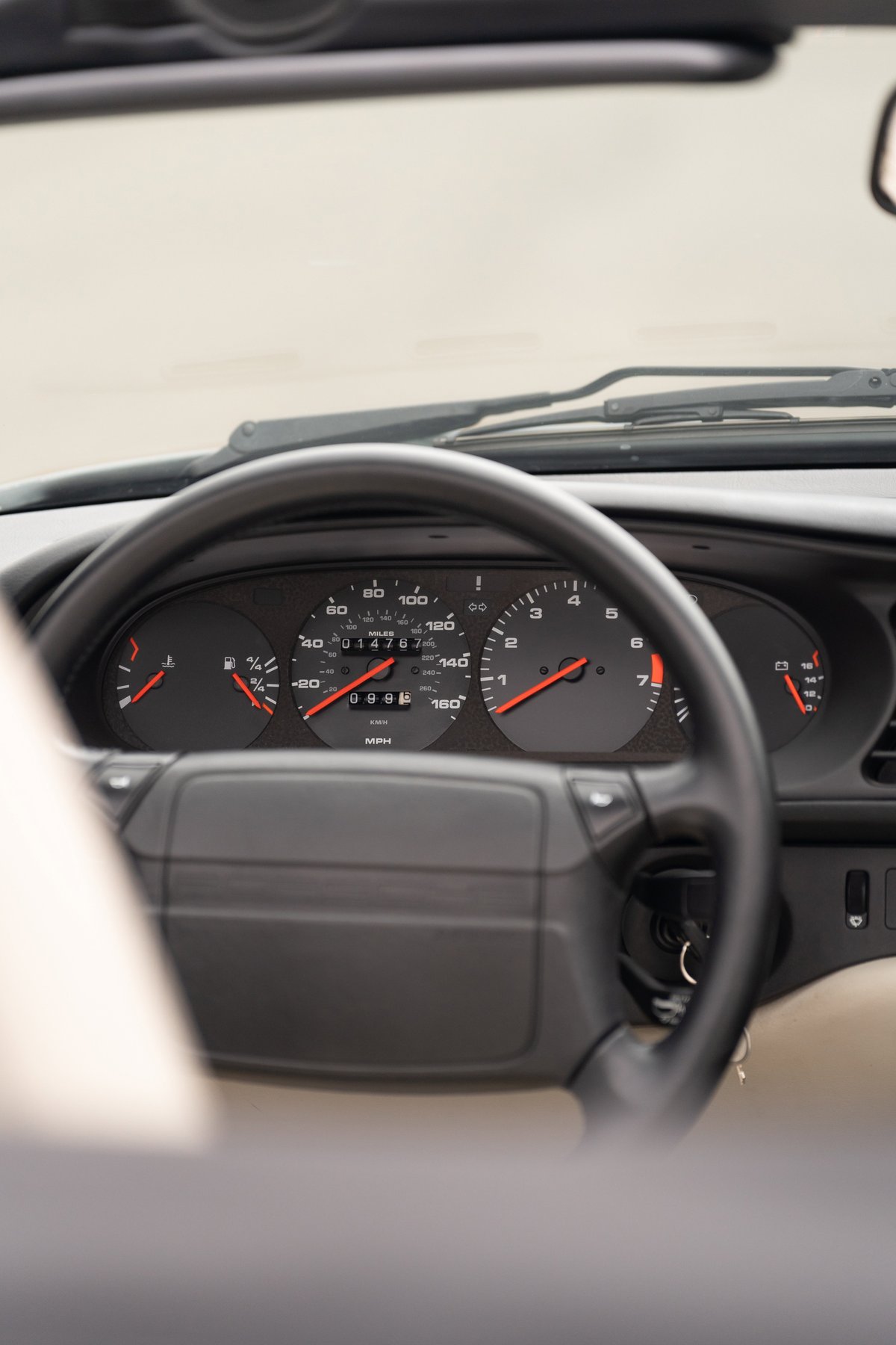 1990 Porsche 944 S2 Cabriolet dash: tachometer, speedometer, fuel gauge, and temperature gauge.