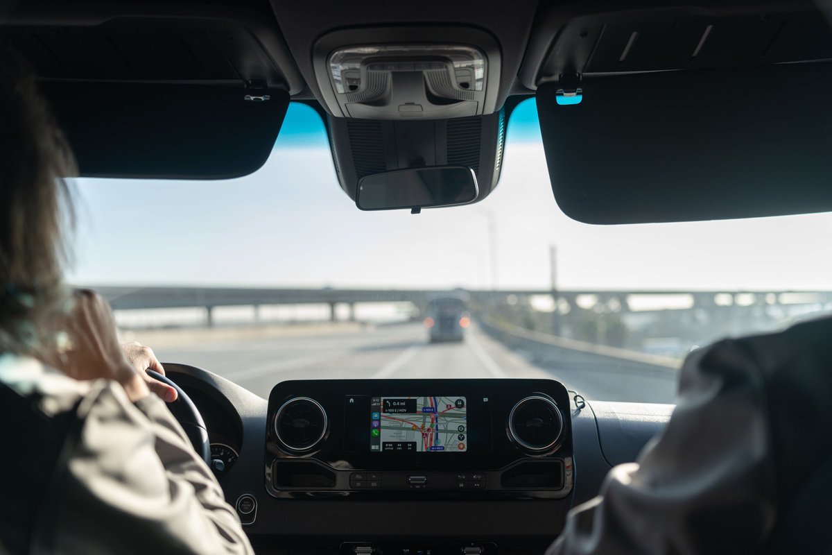 Interior view of a Mercedes-Benz Sprinter van's infotainment screen and dashboard.