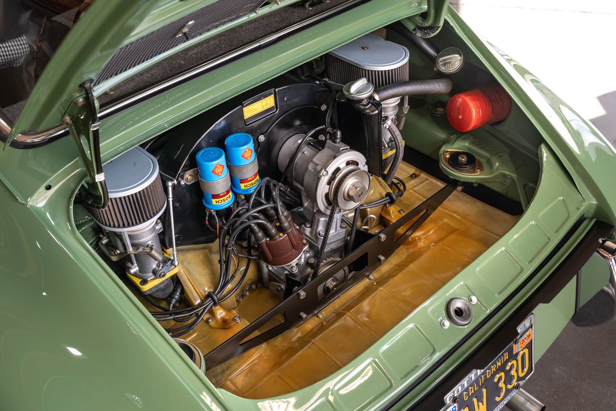 1971 Porsche 911 T engine bay: green paint, twin carburetors, Bosch ignition.