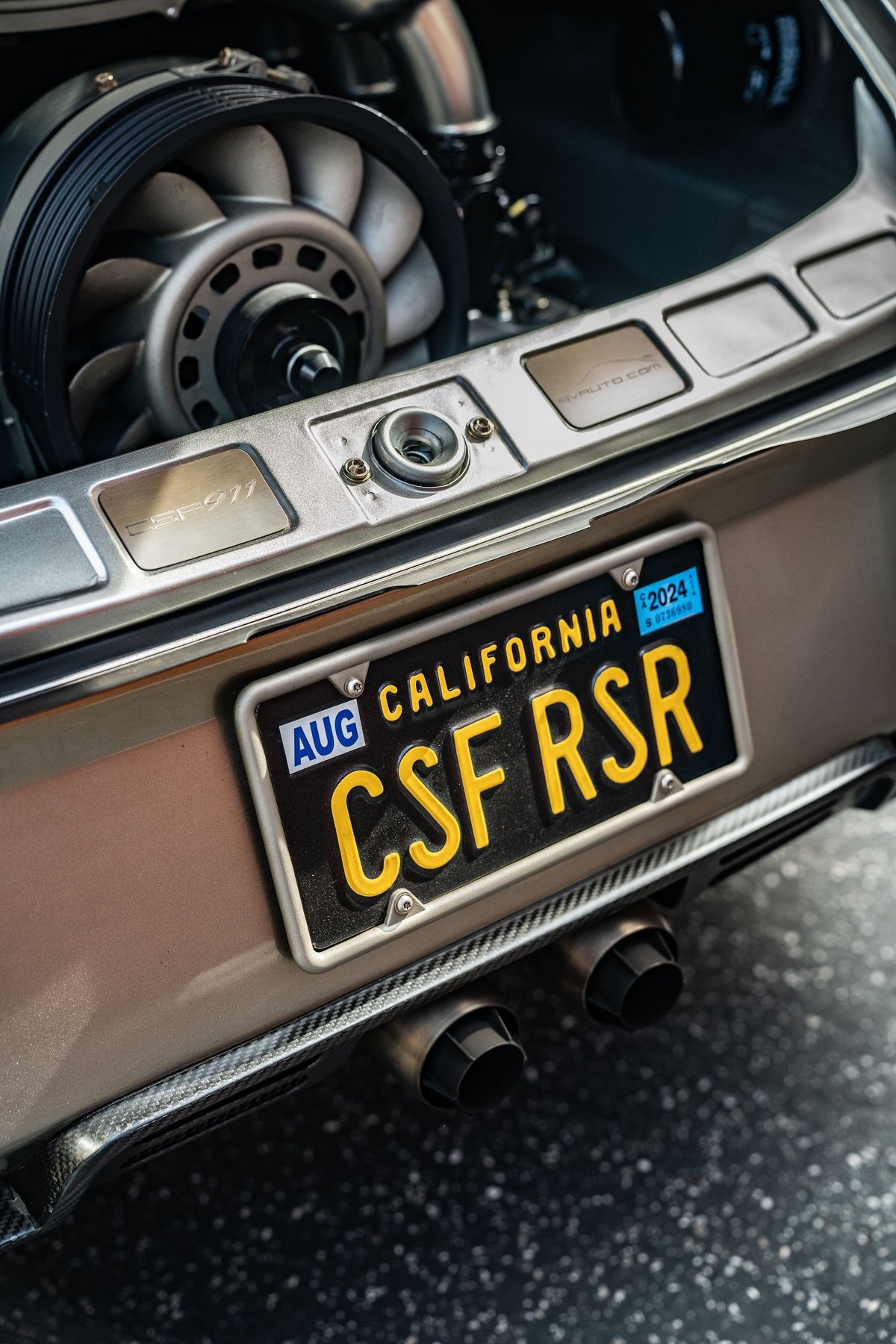 Porsche 911 RSR California plate, fan and exhaust pipes visible.