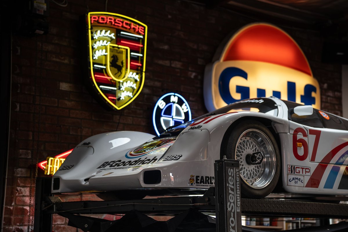 White 1980s Porsche GTP race car with iconic Gulf livery, racing rims, and BFGoodrich sponsorship.