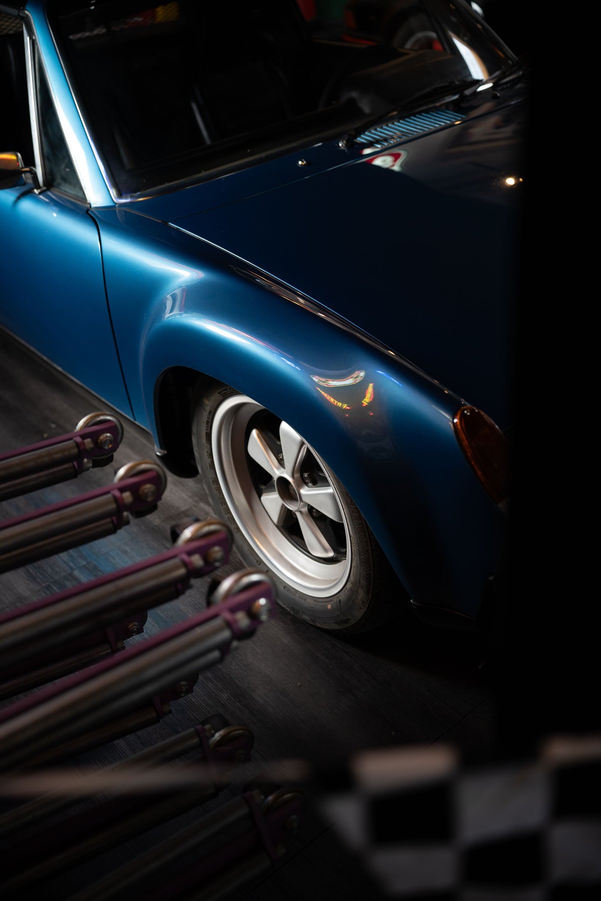 Blue Porsche 914 with Fuchs rims and silver trim.