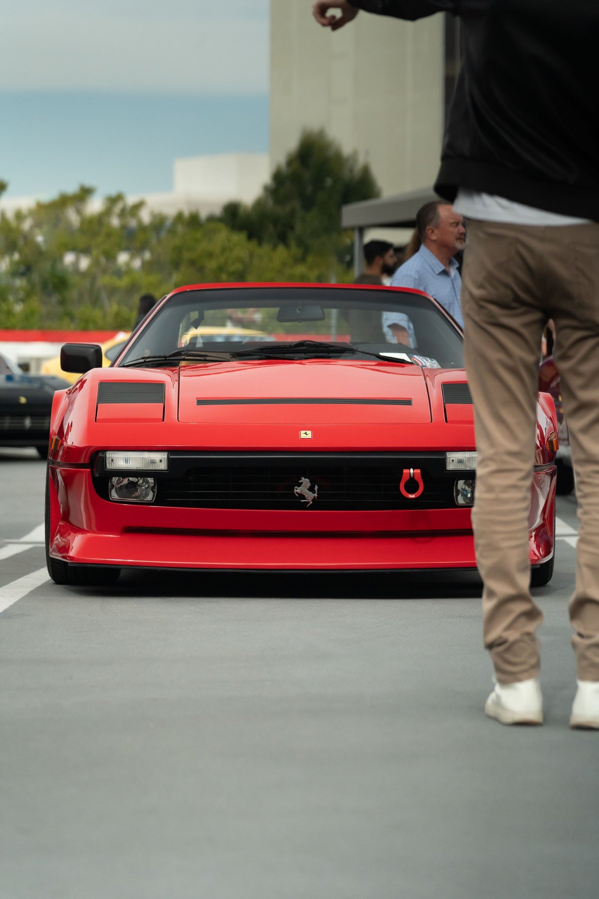 Red Ferrari Testarossa with black trim and front tow hook at Lit Show Los Angeles.