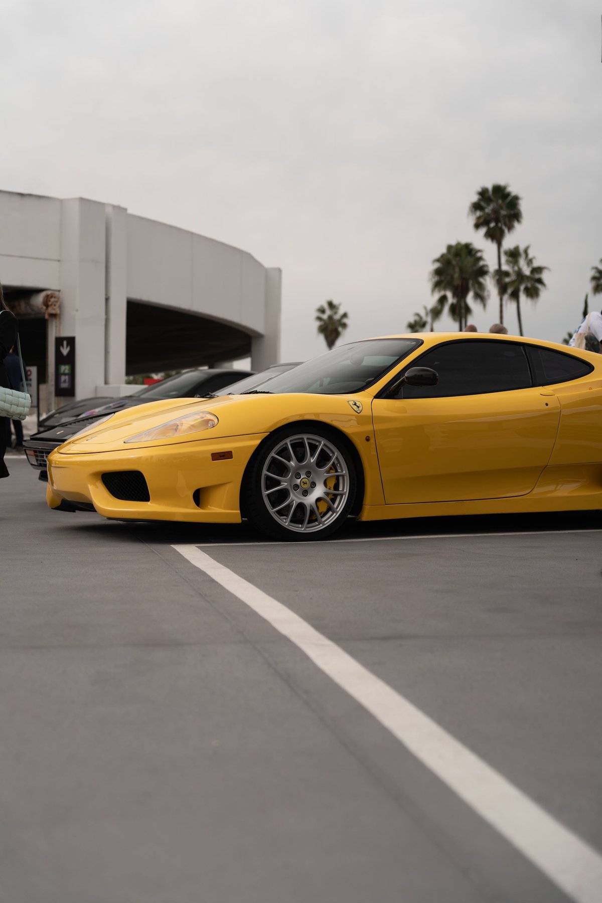 Yellow Ferrari 360 Modena with silver five-spoke rims.