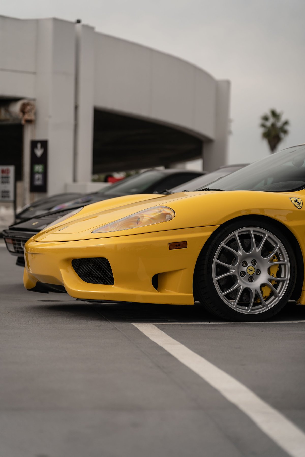 Yellow Ferrari 360 Modena with silver multi-spoke rims and yellow brake calipers.