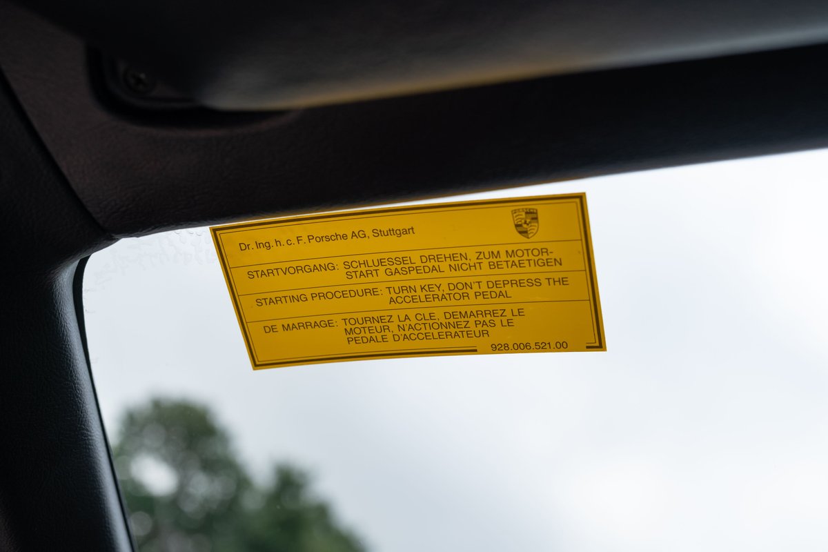 Yellow Porsche 924 Turbo decal on windshield with starting instructions.