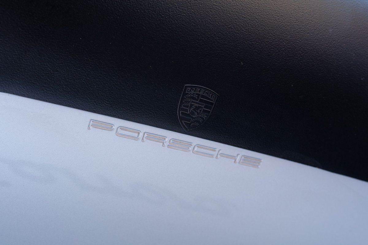 Silver 1987 Porsche 911 Carrera G50 emblem and badging.