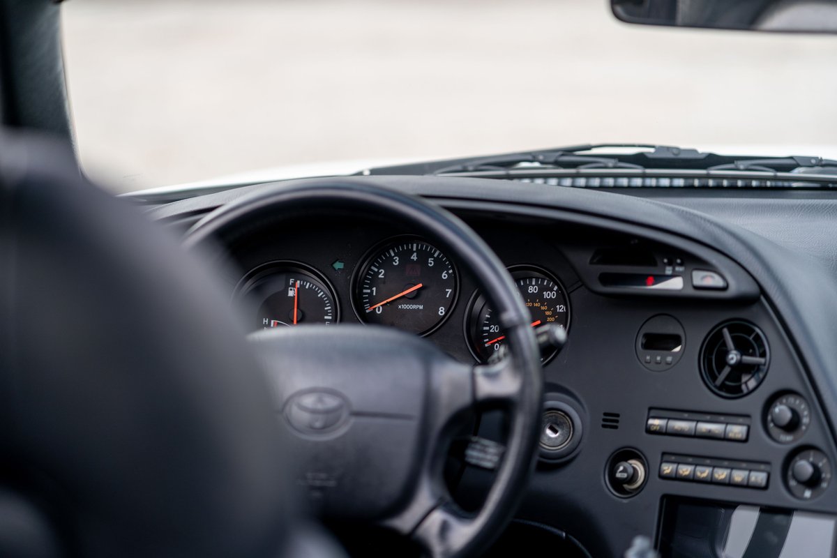 1994 Toyota Supra dashboard: speedometer, tachometer, and central console.