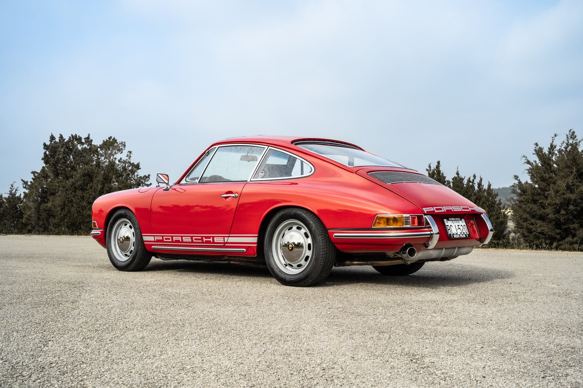 1967 Porsche 912 Coupe in Polo Red, featuring chrome Fuchs rims and iconic side script livery.