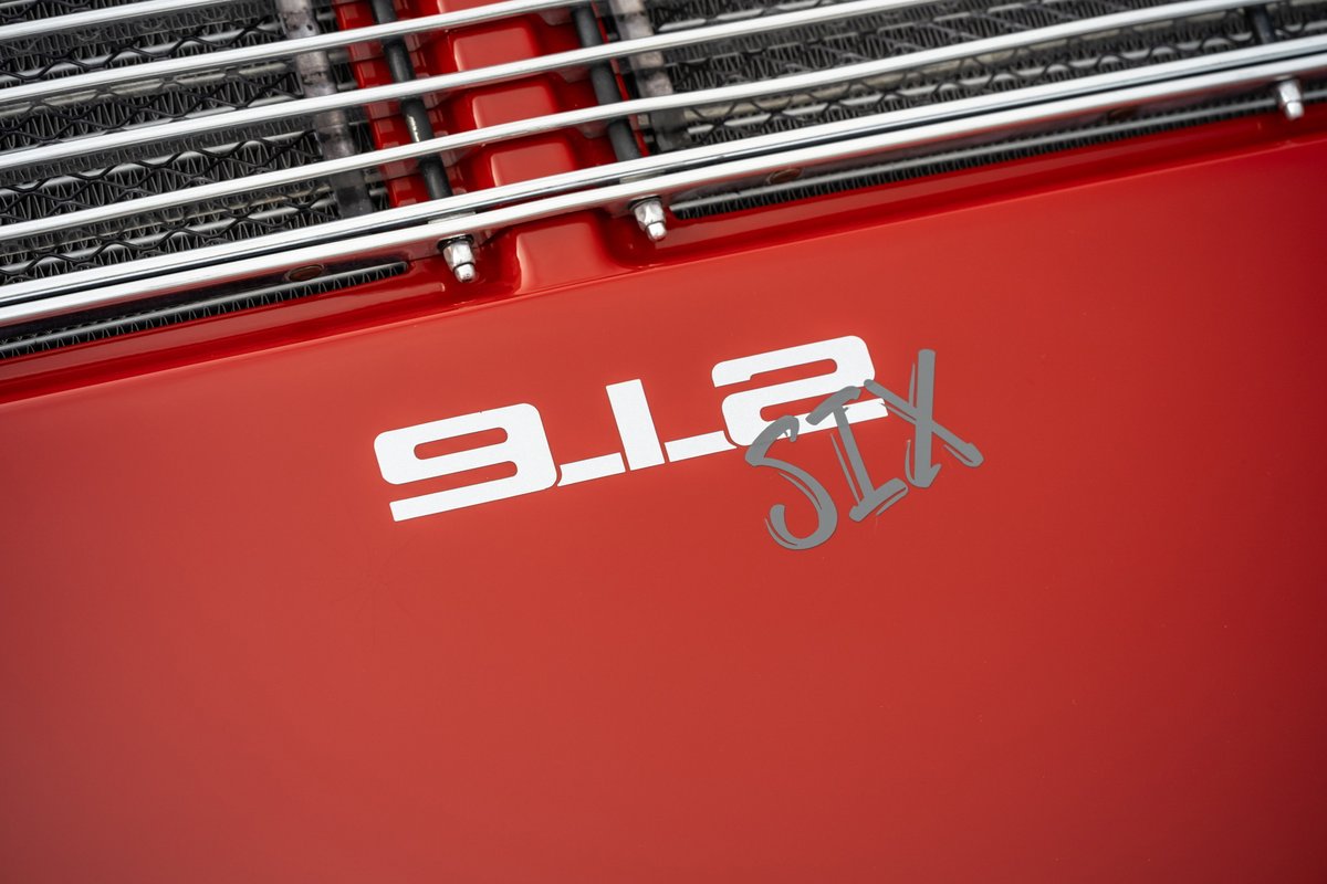 Red 1967 Porsche 912 6-Cylinder coupe with "912 SIX" badging.