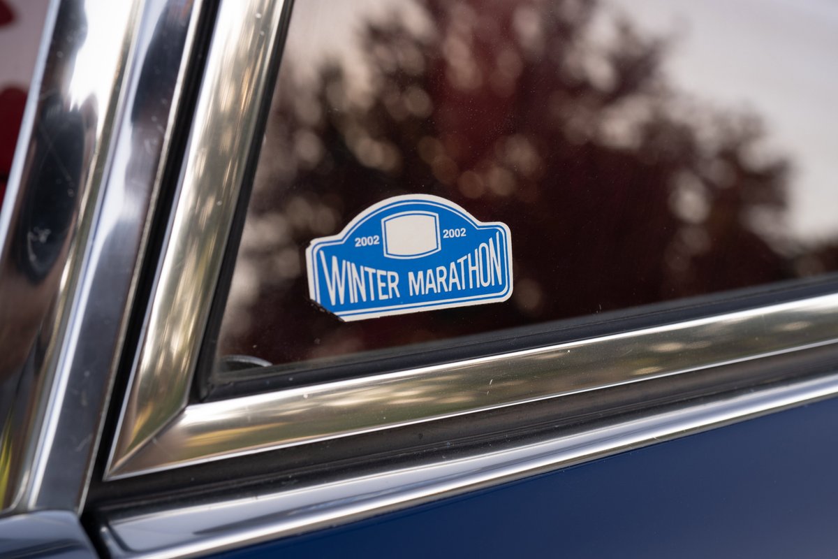 Blue 1969 Porsche 911S with a "Winter Marathon 2002" sticker on the window.