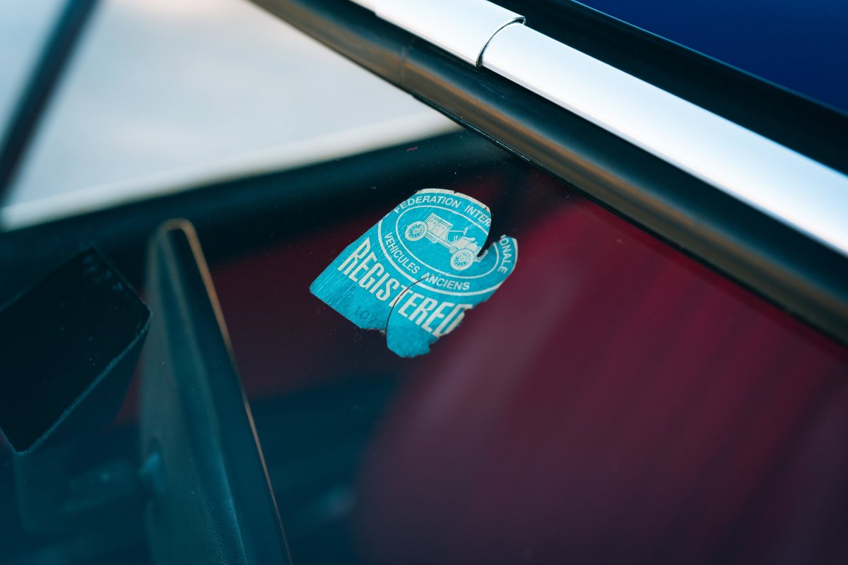 1969 Porsche 911S with vintage registration sticker on the windshield.