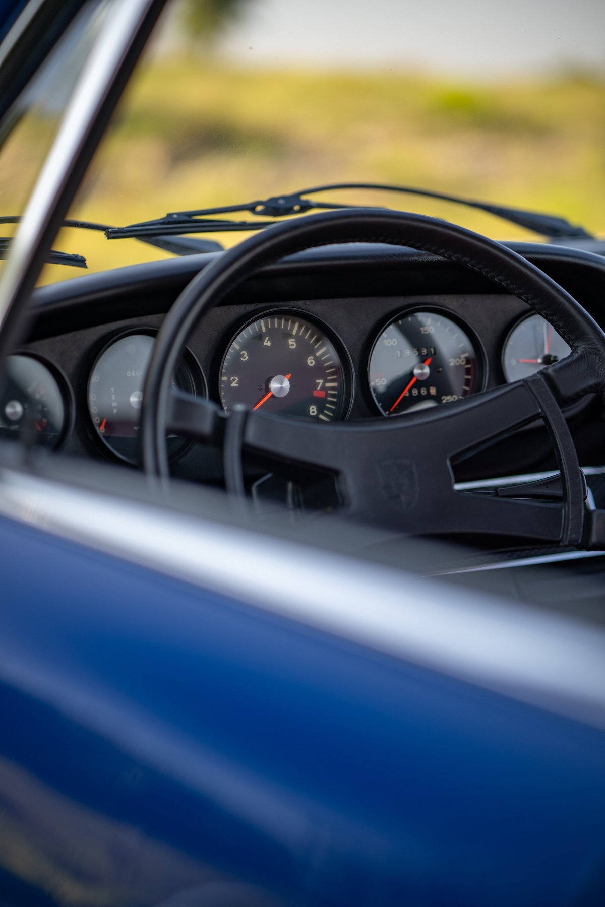 Classic 1969 Porsche 911S dashboard in blue exterior.