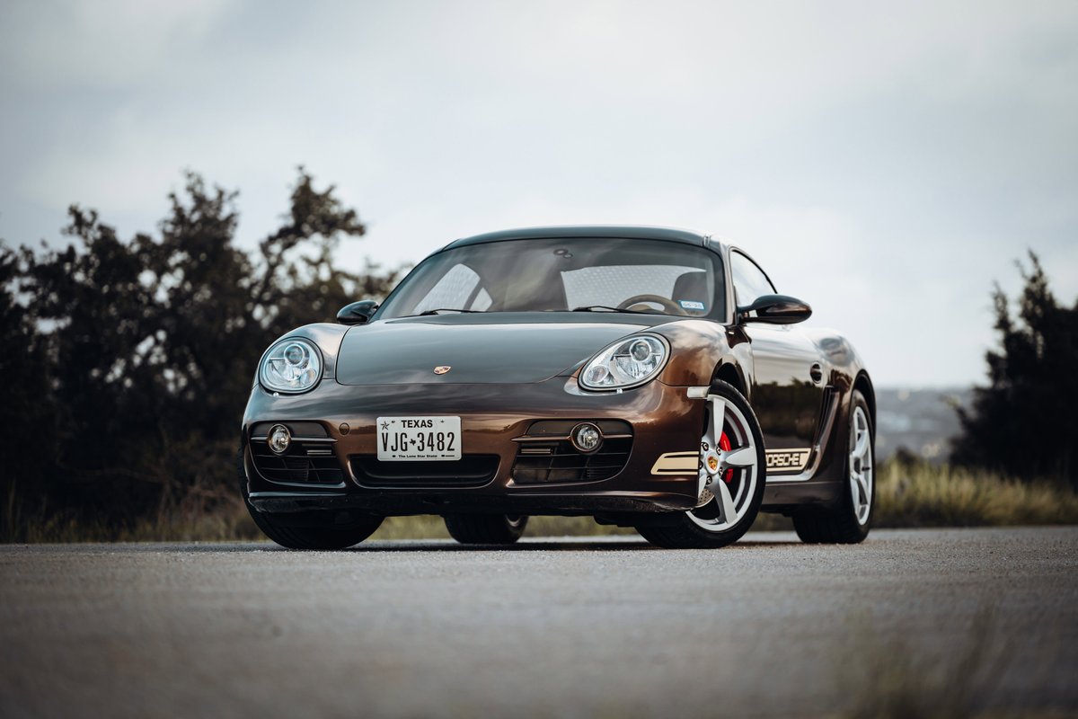 Brown 2008 Porsche Cayman S with silver rims and black trim.