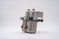 Vintage Porsche 550 Spyder fuel filter assembly, raw metal finish.