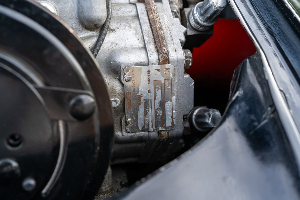 Close up of a black 1976 Porsche 911S Sportomatic engine detail.