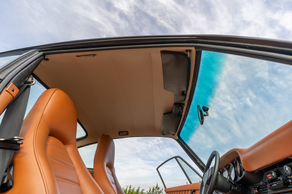 1976 Porsche 911S Sportomatic interior with tan leather seats and headliner.