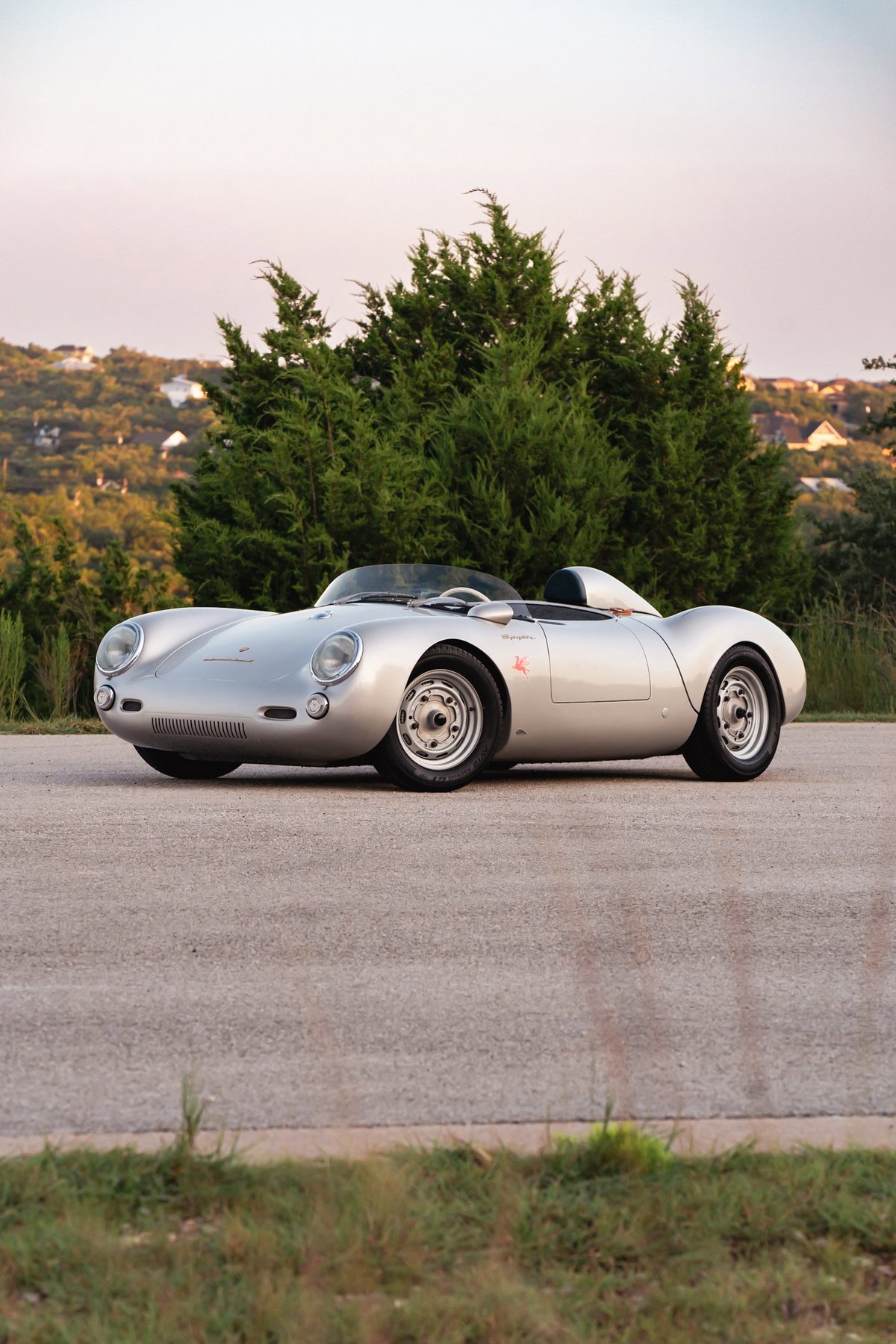 Silver Beck 550 Spyder roadster with classic racing rims and minimal trim.