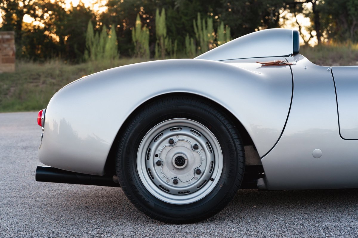 Silver Beck 550 Spyder rear quarter panel with classic alloy rims and black exhaust.