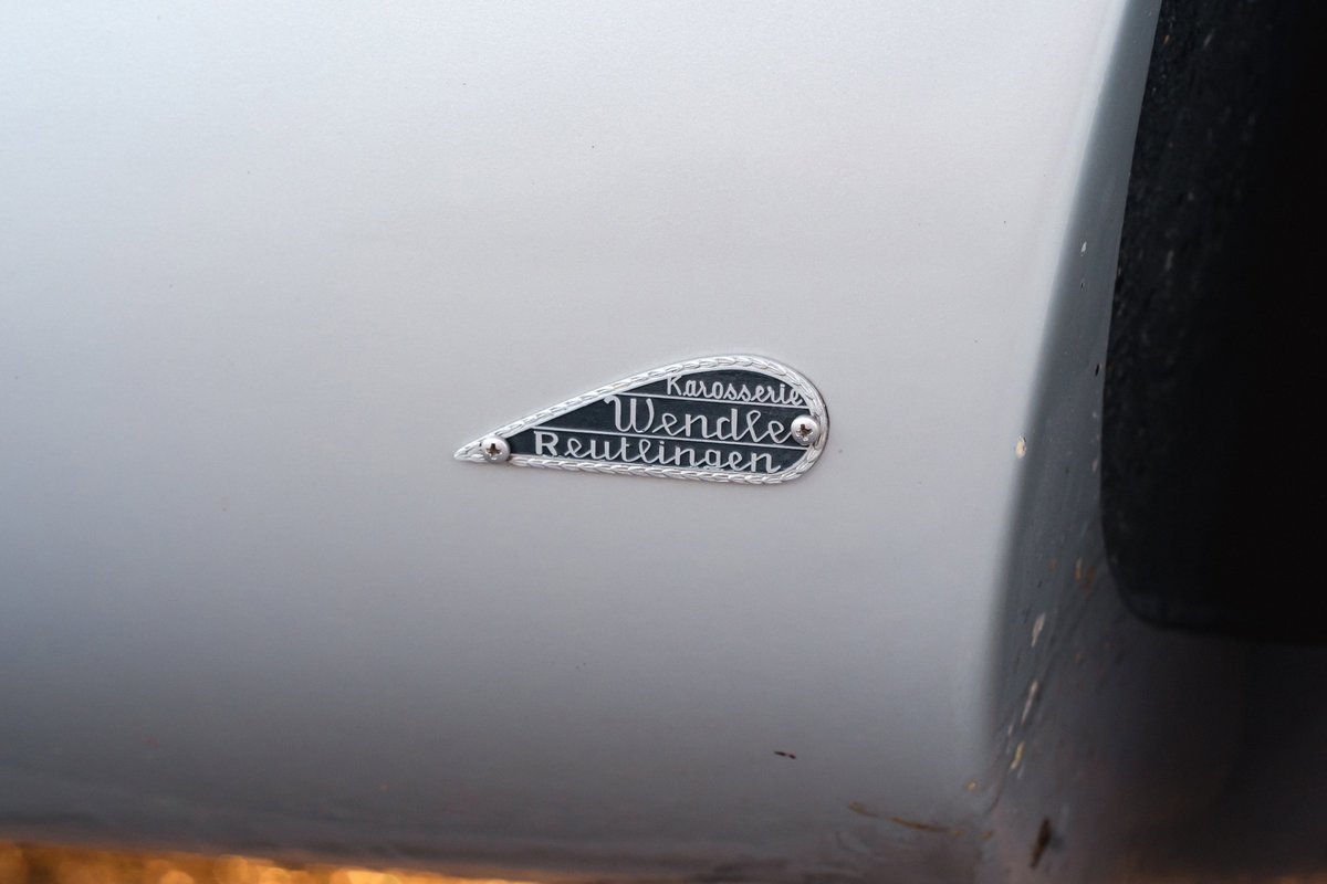 Close-up of a silver Beck 550 Spyder with a Karosserie Wendle Reutlingen badge.