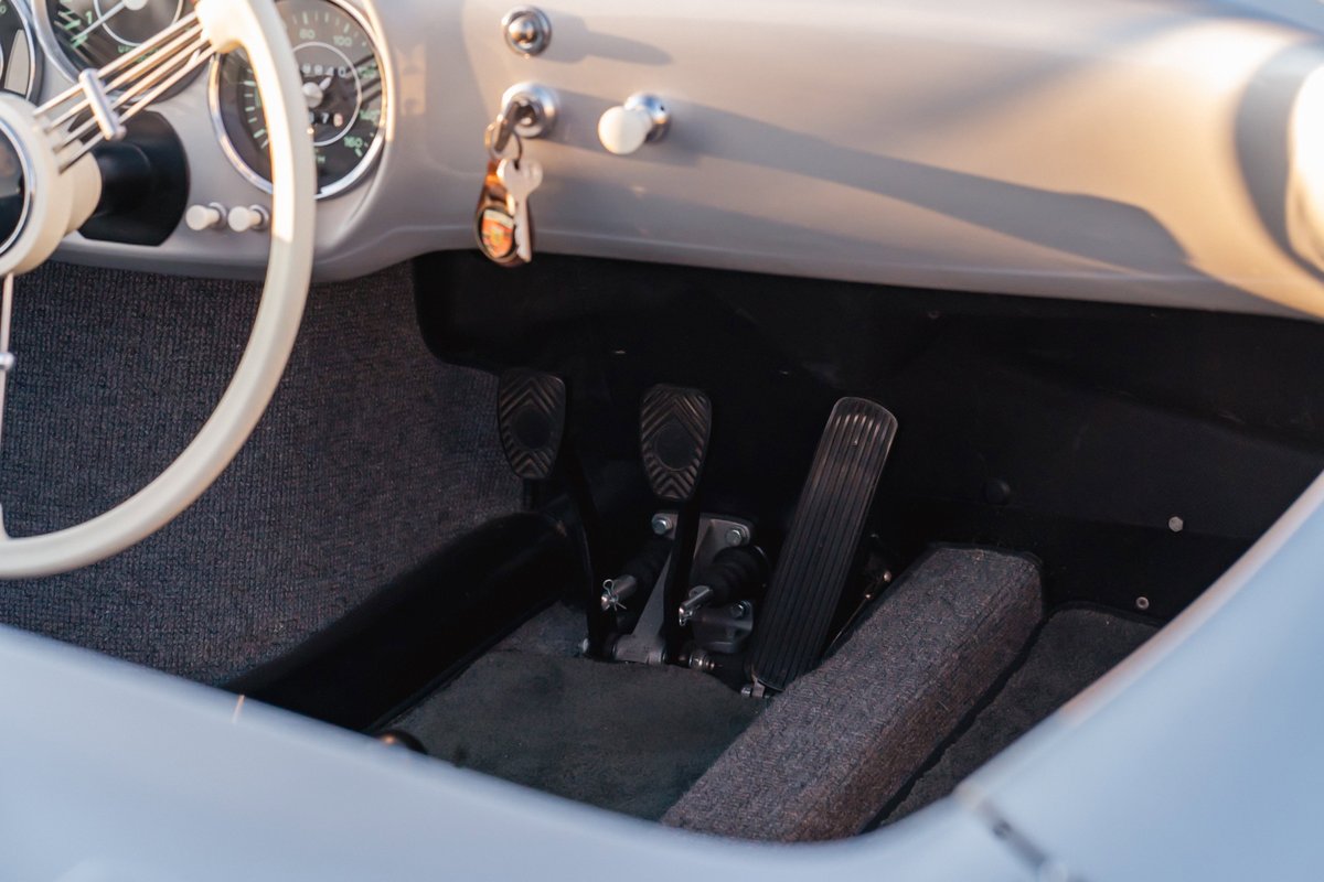 Interior of a Beck 550 Spyder with three-pedal setup and vintage dashboard.