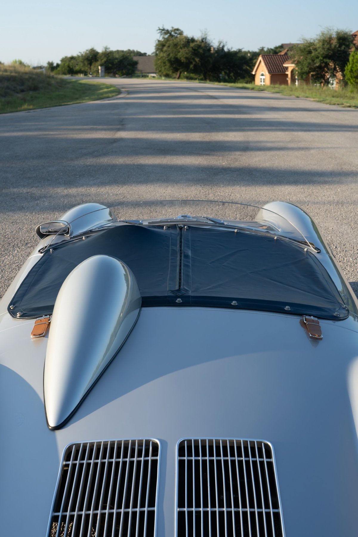 Silver Beck 550 Spyder with a black soft top and chrome grille.