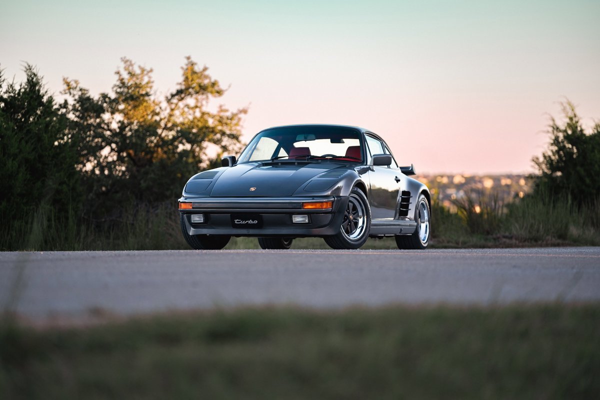Slate grey metallic 1989 Porsche 930 Turbo Flachbau with red interior and Fuchs rims.