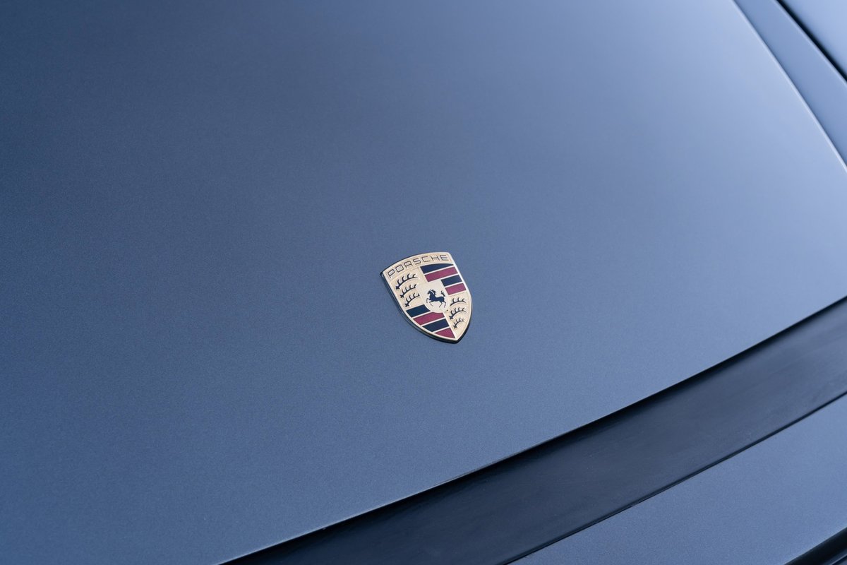 Slate Grey Metallic 1989 Porsche 930 Turbo Flachbau emblem on hood.
