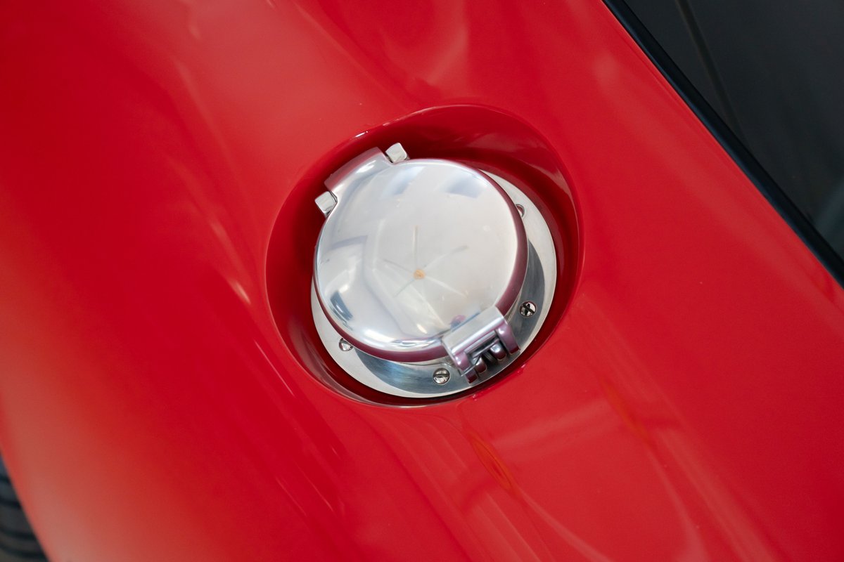 Detail of the chrome fuel filler cap on a red 1965 Shelby Daytona CSX.
