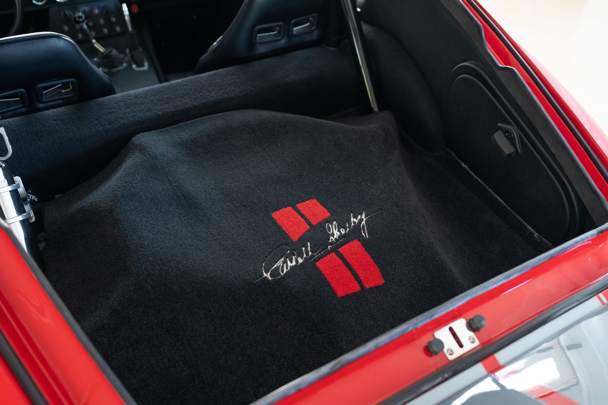Red 1965 Superformance Shelby Daytona CSX trunk with Carroll Shelby signature floor mat.