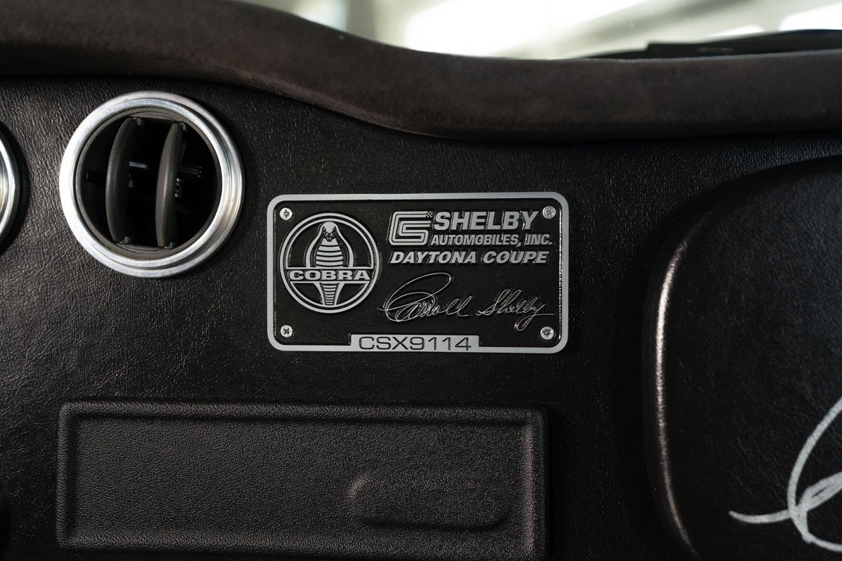 Shelby Daytona Coupe CSX9114 dash plaque, featuring Cobra emblem and Bill Shelby signature.