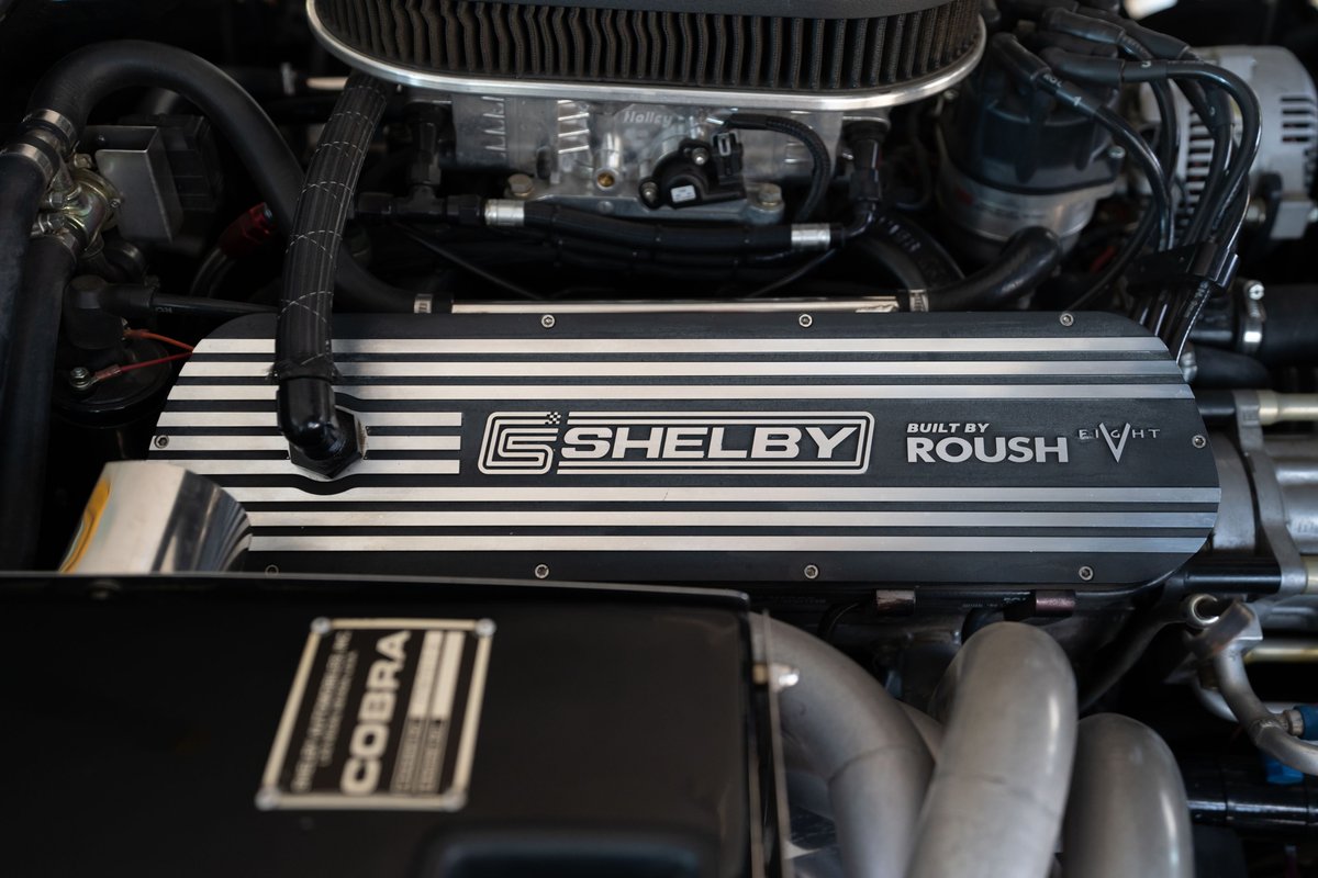 Close-up of a 1965 Shelby Cobra Daytona CSX engine bay, featuring Roush-built Shelby valve covers.