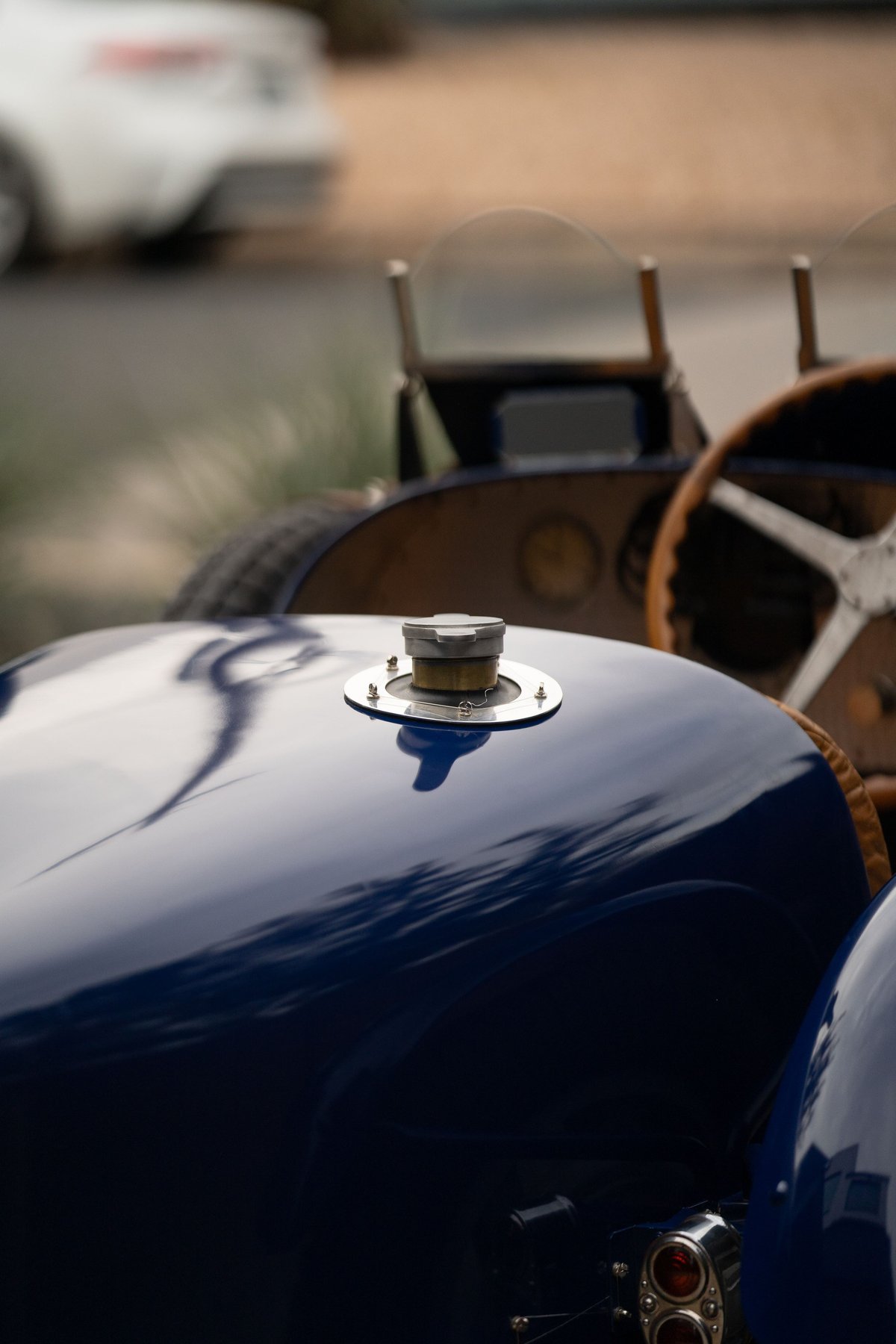 Close-up of a blue 1927 Bugatti Type 35 Pur Sang with a silver fuel cap.