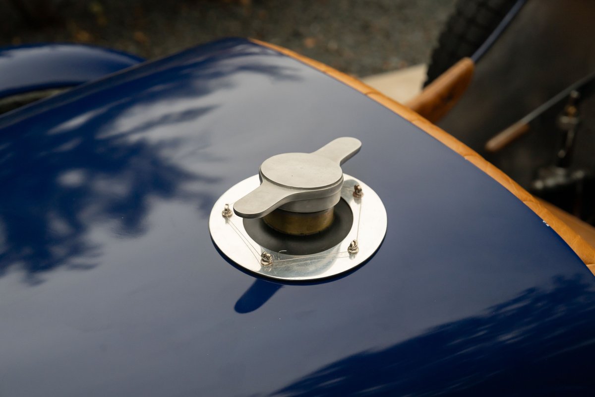 1927 Bugatti Type 35 Pur Sang in deep blue, showing a polished metal flip-top fuel cap.