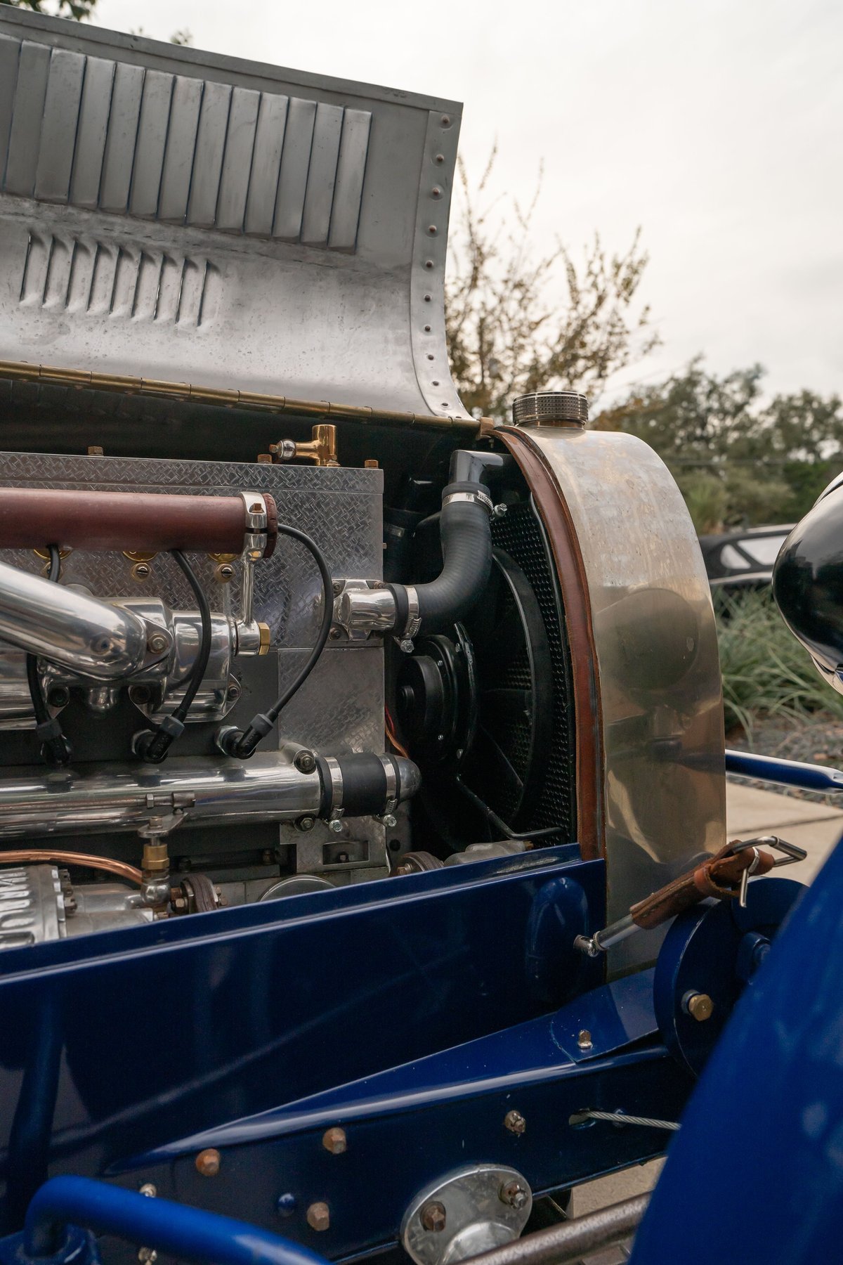 1927 Bugatti Type 35 engine bay with polished chrome and a blue chassis.