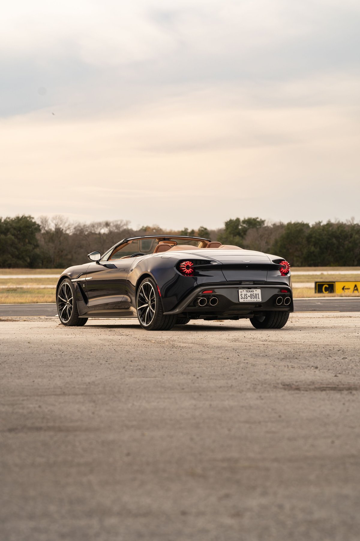 Rear view of an Orient Blue 2018 Aston Martin Vanquish Zagato Volante with tan interior and multi-spoke rims.