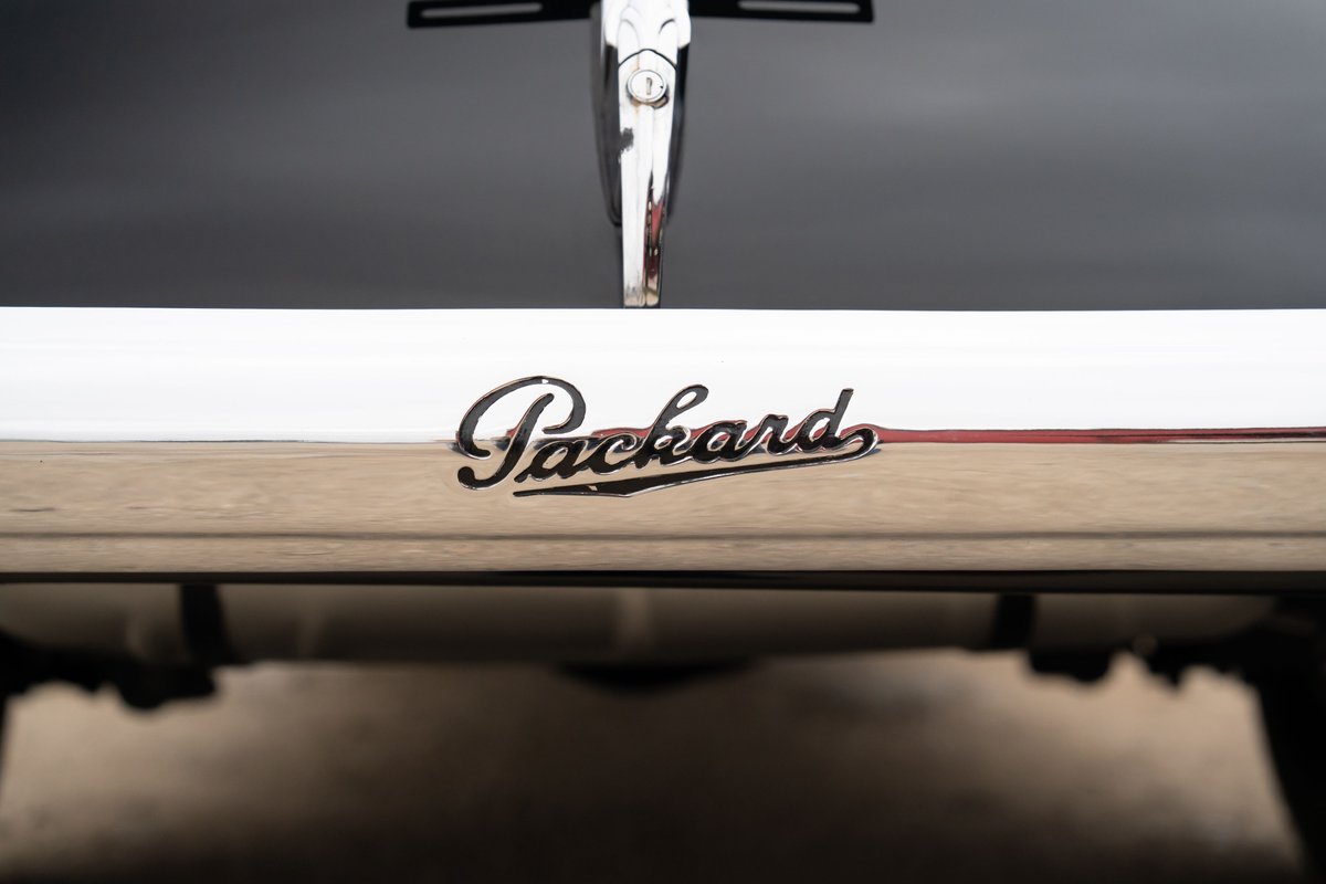 Packard Super Eight One Eighty emblem on chrome trim.