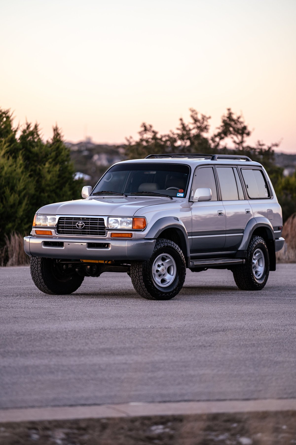 1997 Toyota Land Cruiser FJ80 in Desert Dune Metallic, stock rims and trim.