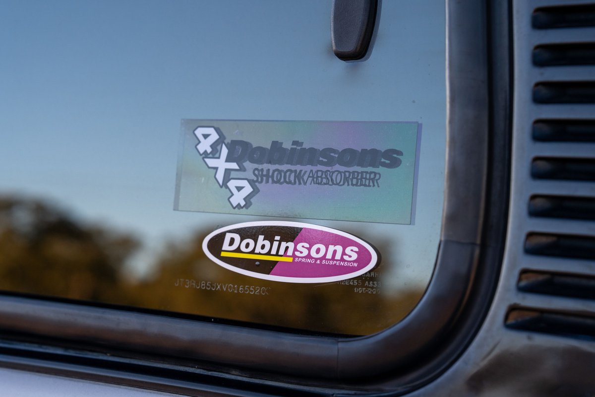 Sticker detail on the window of a 1997 Toyota Land Cruiser FZJ80.
