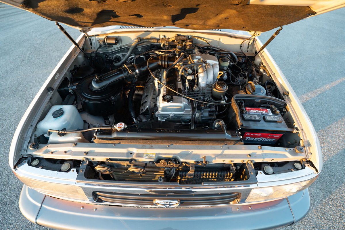 Engine bay of a Desert Dune Metallic 1997 Toyota Land Cruiser FZJ80.