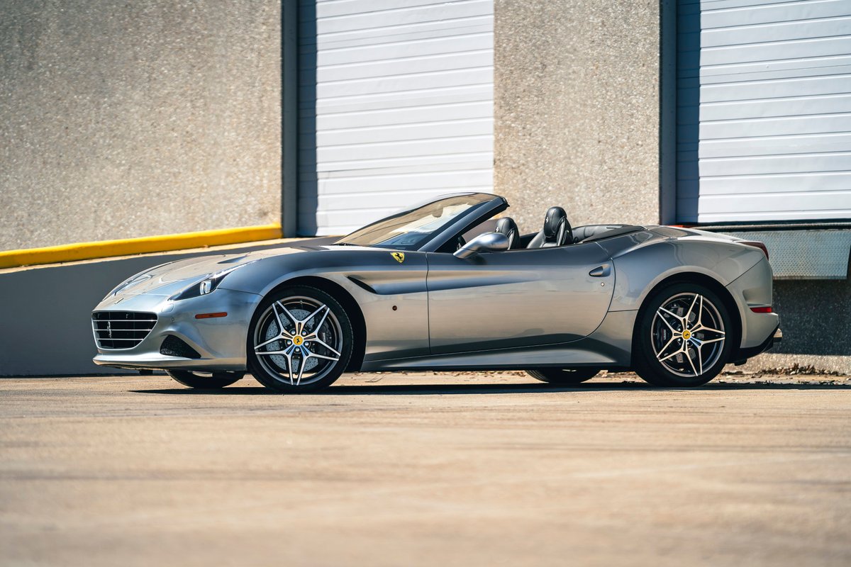 2016 silver Ferrari California T convertible with star-design rims.