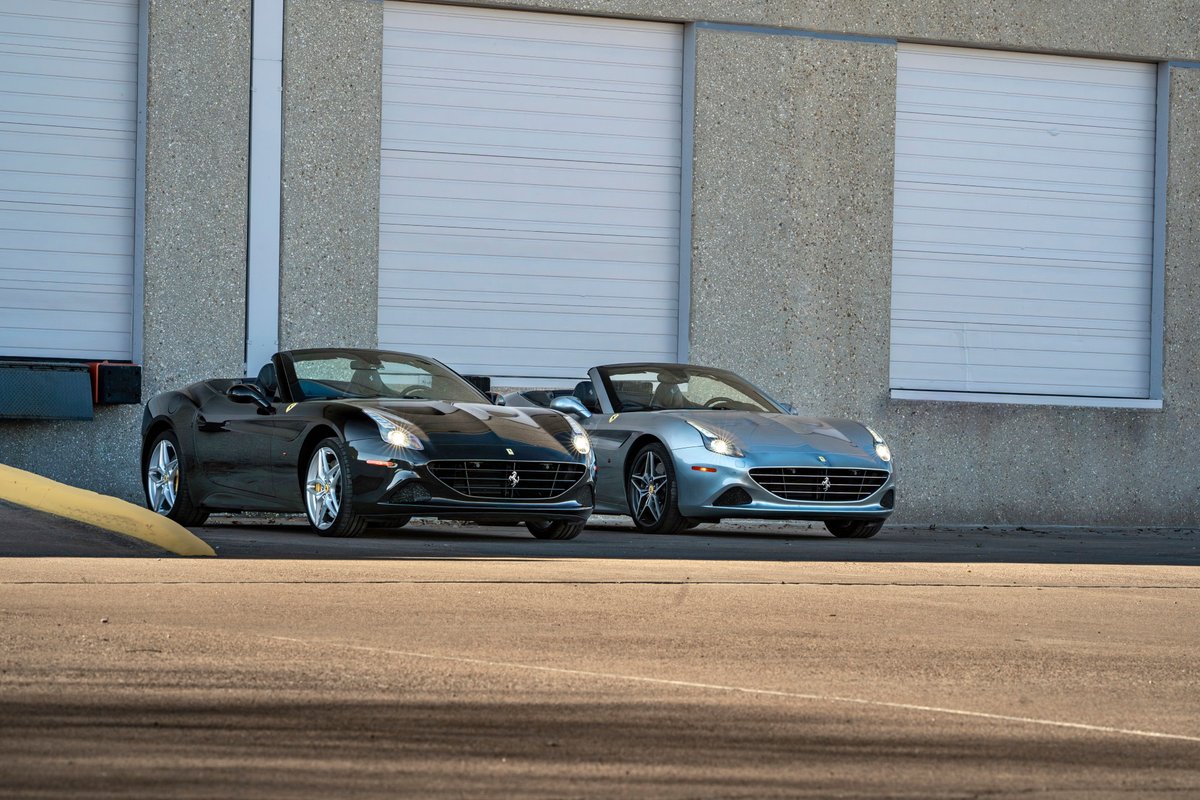 Silver 2016 Ferrari California T convertible with five-spoke rims in front of a light blue convertible with similar rims.